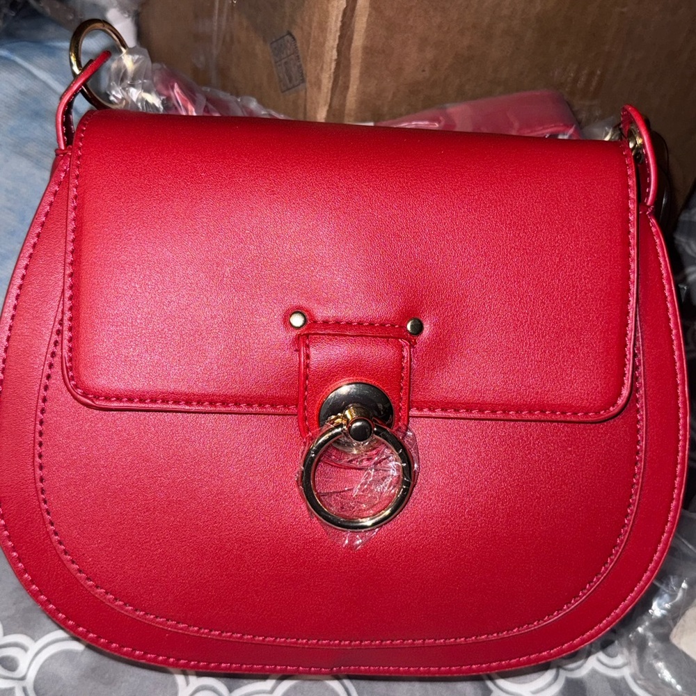 Chic Red Crossbody Saddle Bag with Gold Ring Accent